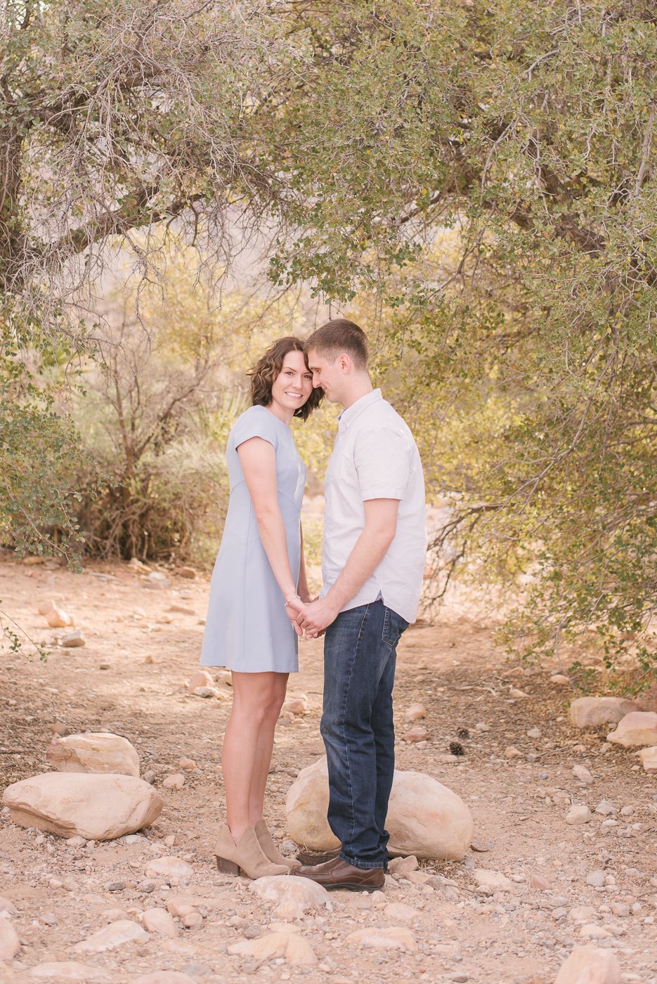 couple standing closely for engagement photo
