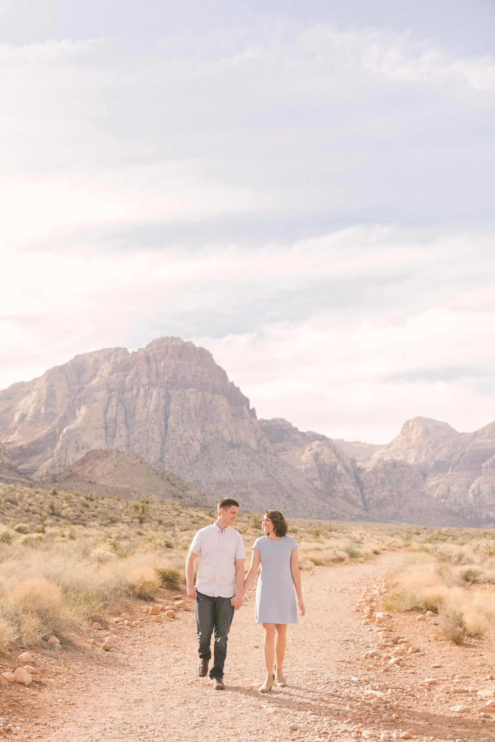 couple walking along desert trail