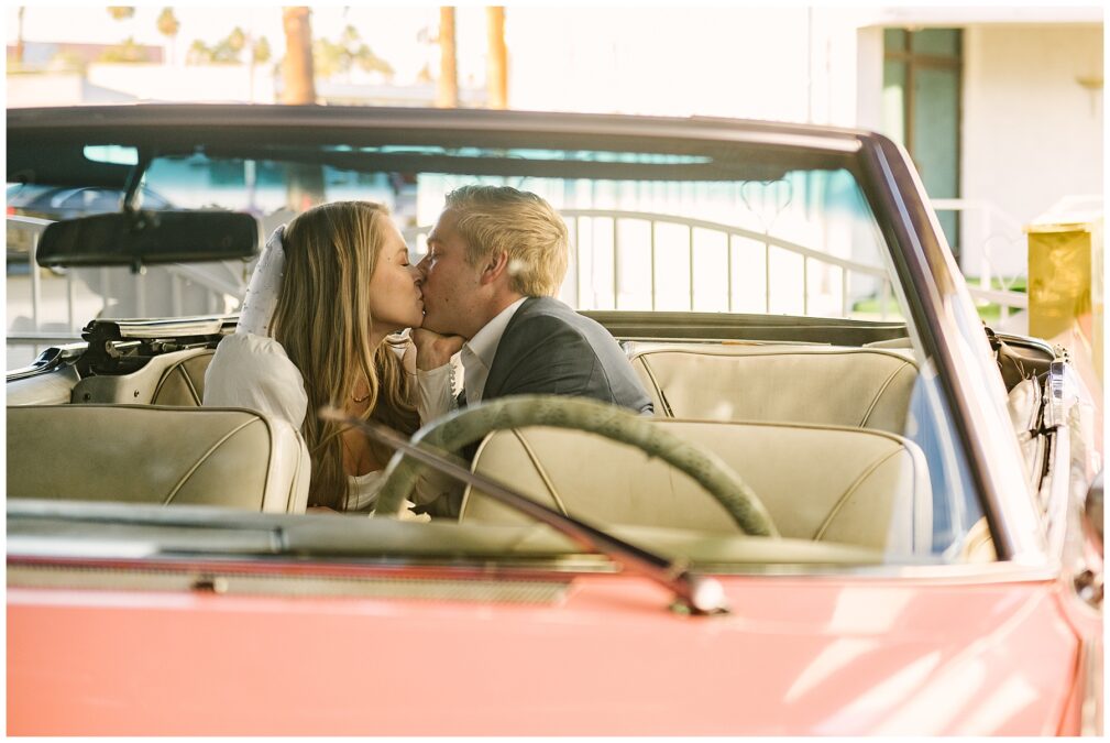 First Kiss inside pink cadillac 