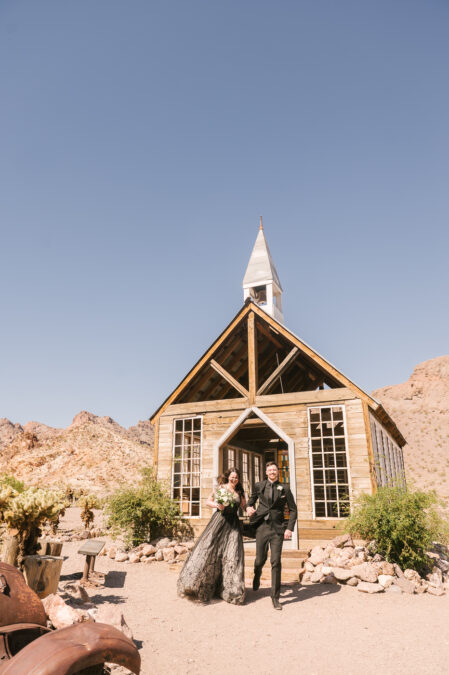 las vegas elopement couple exiting desert ghost town chapel 