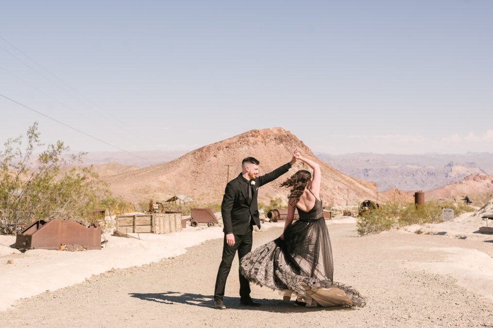 bride and groom dance in desert elopement 