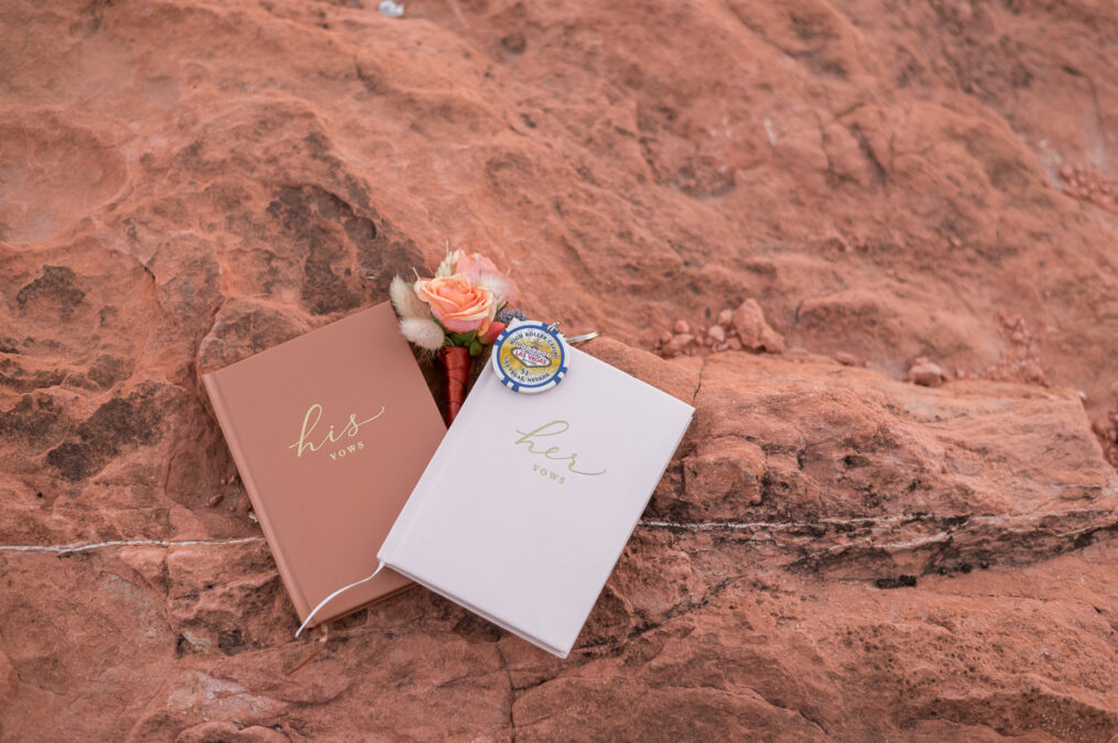 close up of vow books against red sandstone 