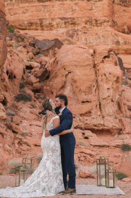 bride and groom first kiss at valley of fire ceremony wedding