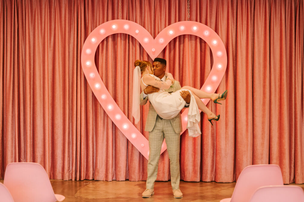 bride and groom at heart shaped alter in sure thing wedding chapel