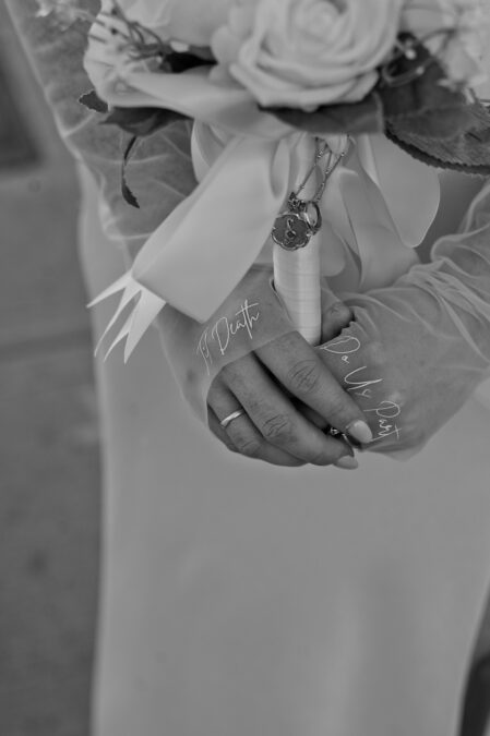 close up of bride wedding gloves