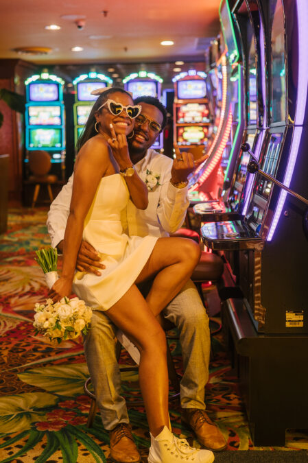bride and groom show off their wedding rings inside El Cortez casino