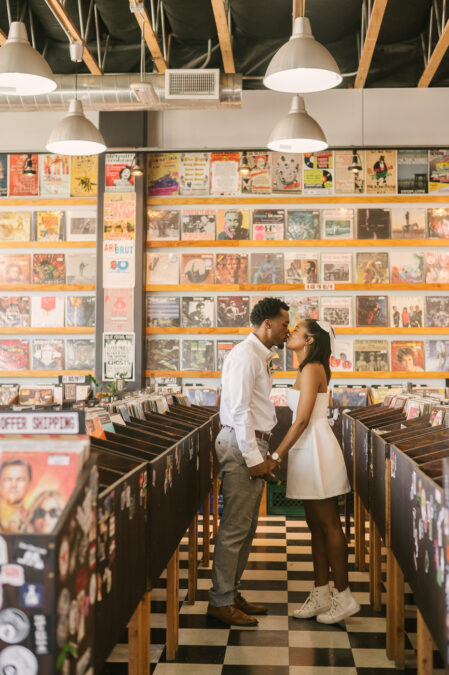 bride and groom kiss in record store downtown las vegas