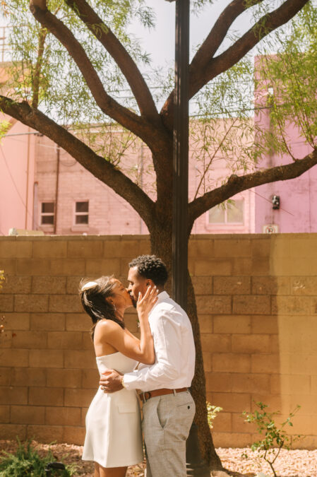 couple kiss as they say i do in downtown elopement ceremony