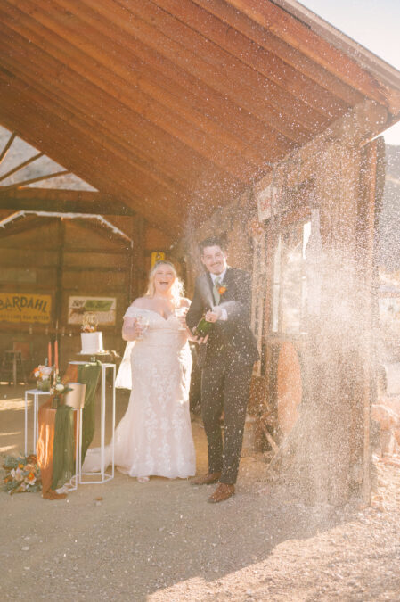 las vegas couple with champagne spray at nelson ghost town 