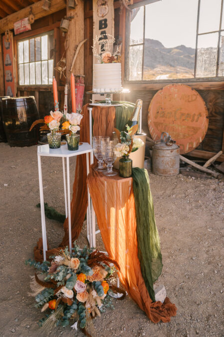 fall theme mini wedding cake and champagne set up for micro wedding