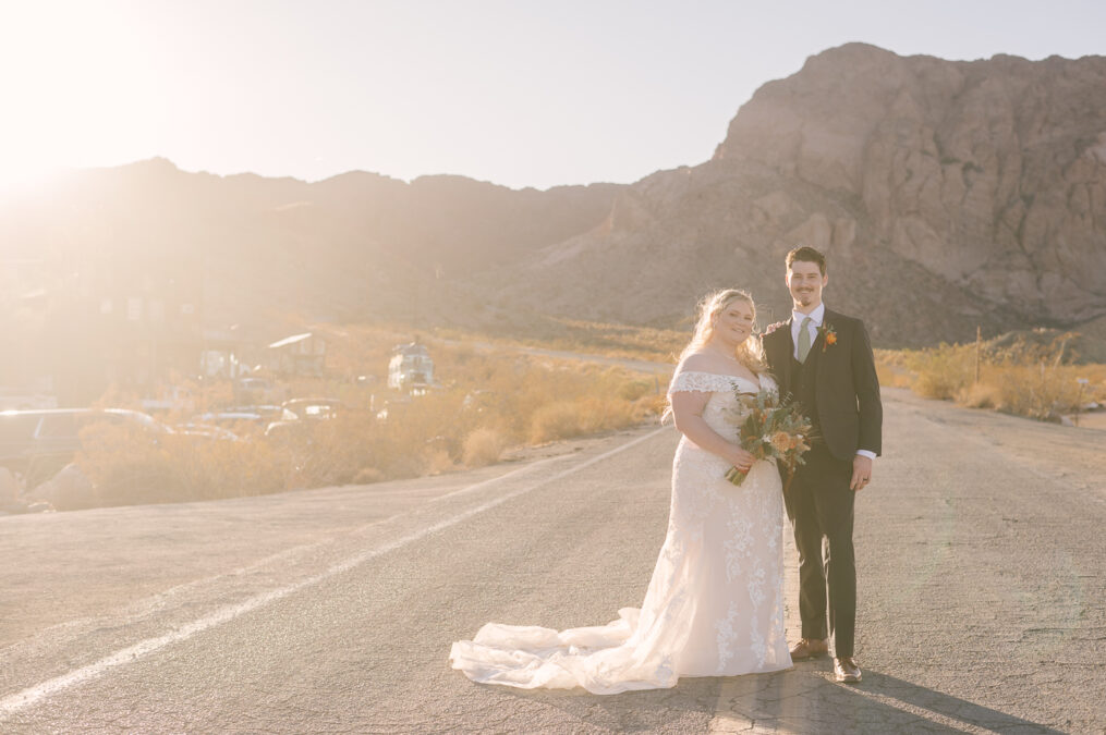 las vegas wedded couple on road at nelson ghost town