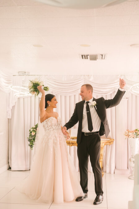 bride and groom happy at the alter in the Las Vegas little white wedding chapel
