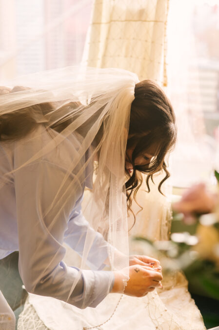 bride getting ready for her wedding at park mgm las vegas hotel room