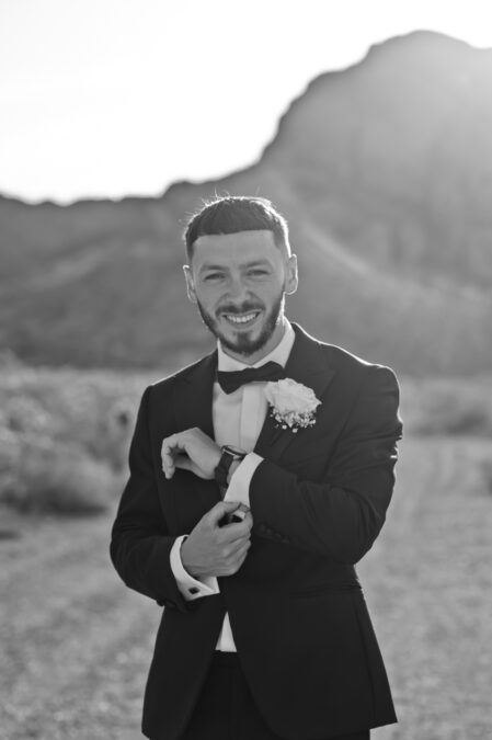 black and white photo of UK groom in desert las vegas wedding 