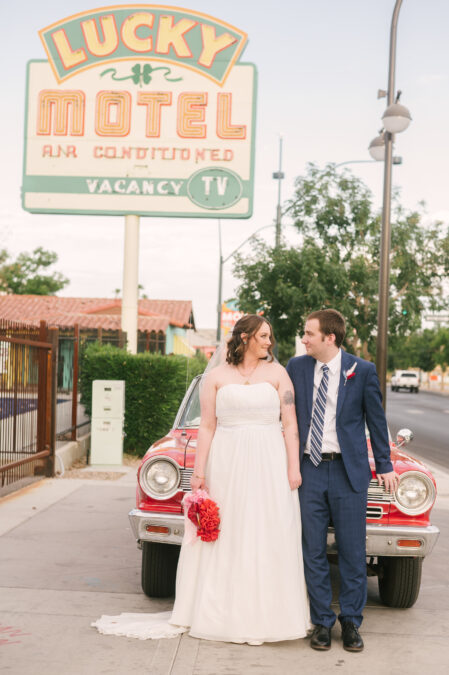downtown las vegas bride and groom with red vintage car 
