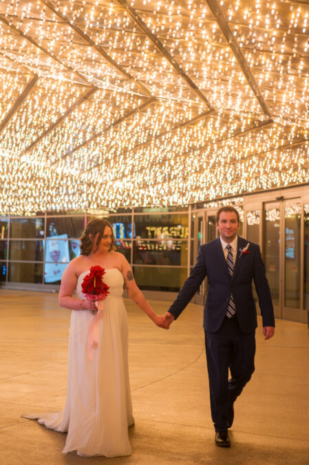 Las Vegas bride and groom photos under the neon lights of The Plaza Hotel