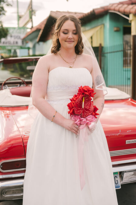 downtown las vegas bride with red vintage car from sure thing chapel
