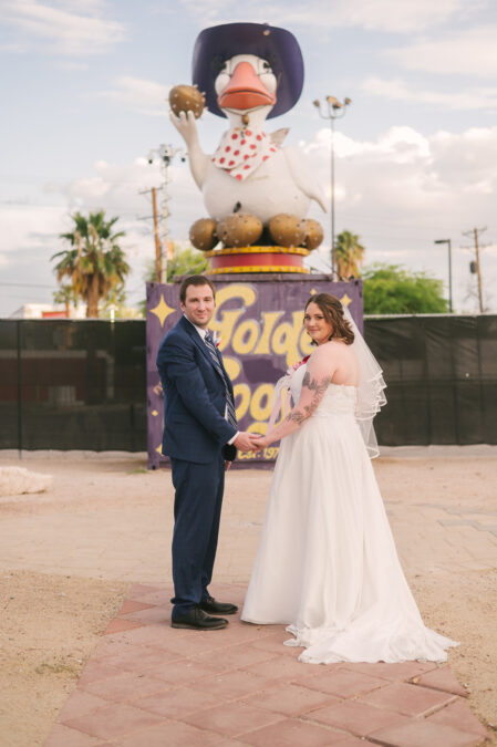 bride and groom walking around downtown las vegas