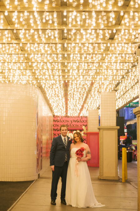 Las Vegas bride and groom photos under the neon lights of The Plaza Hotel
