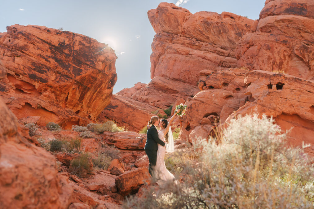 same sex couple celebrating their marriage nestled in the red rocks of Valley of Fire