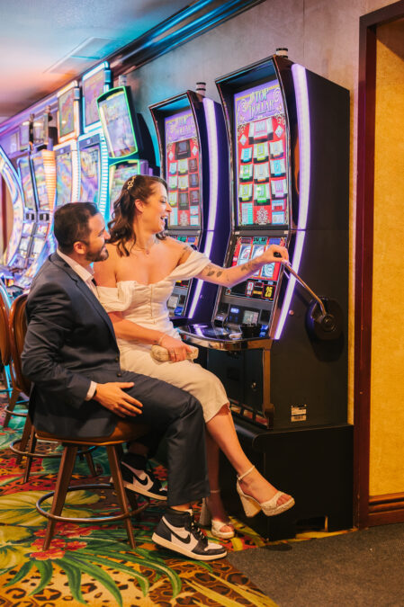 bride and groom gambling at El Cortez casino on fremont street after wedding