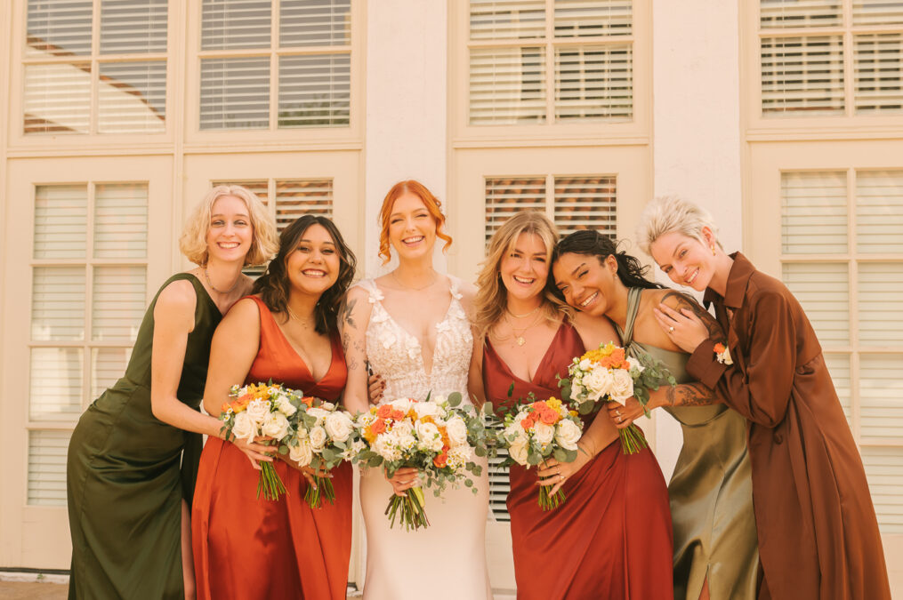 bride and bridesmaids with fall theme color scheme