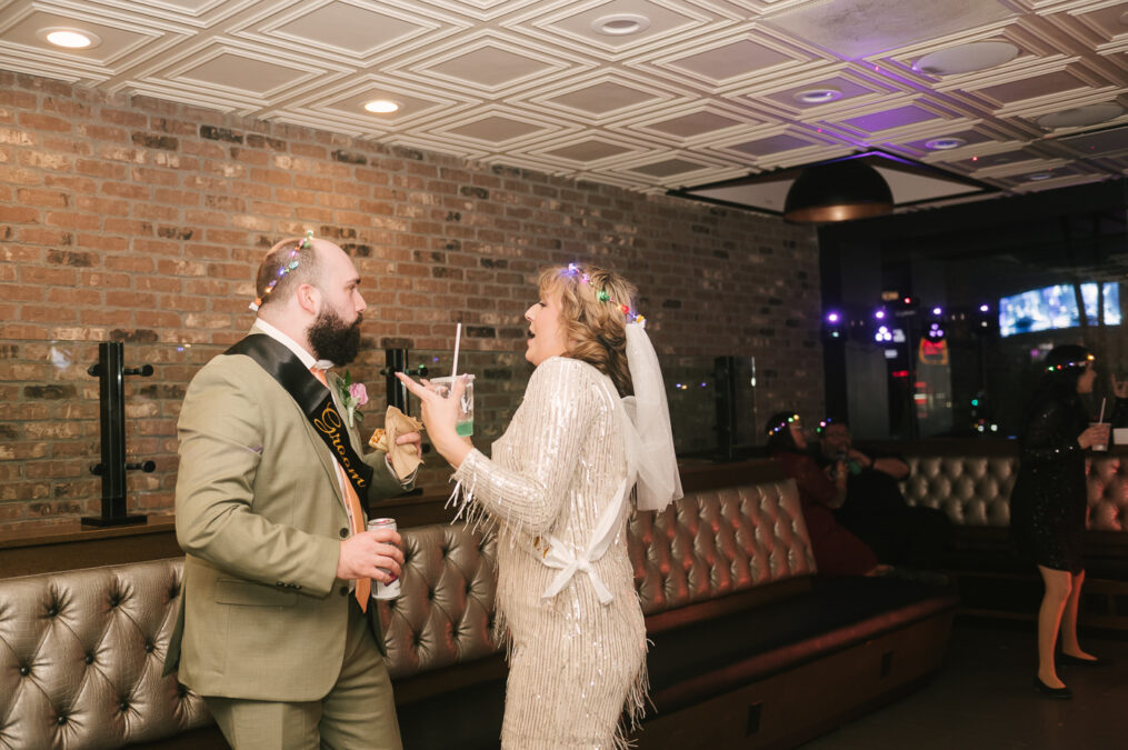 bride and groom dancing with taco bell food 