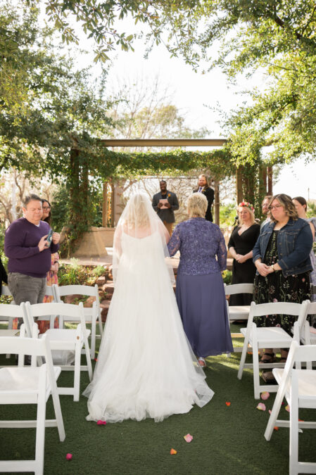bride walking down aisle at springs preserve ceremony