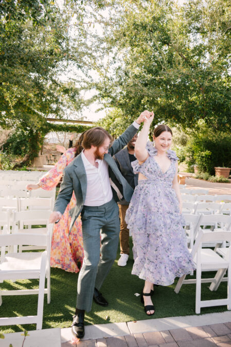 guests dancing down the aisle at springs preserve 