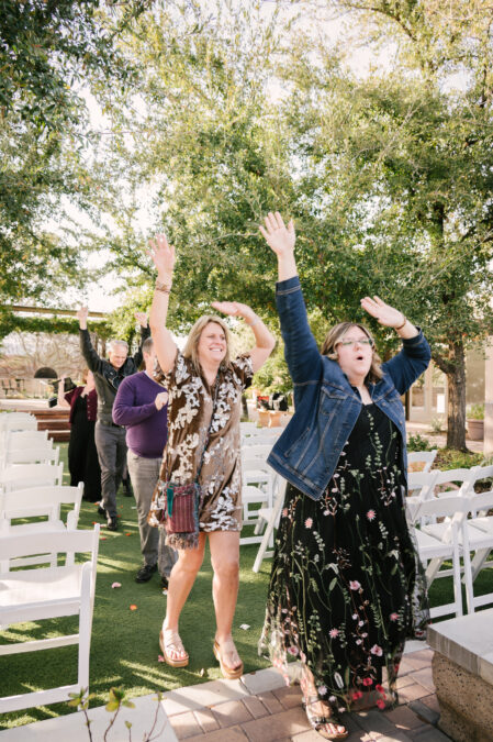 guests dancing down the aisle at las vegas wedding at springs preserve